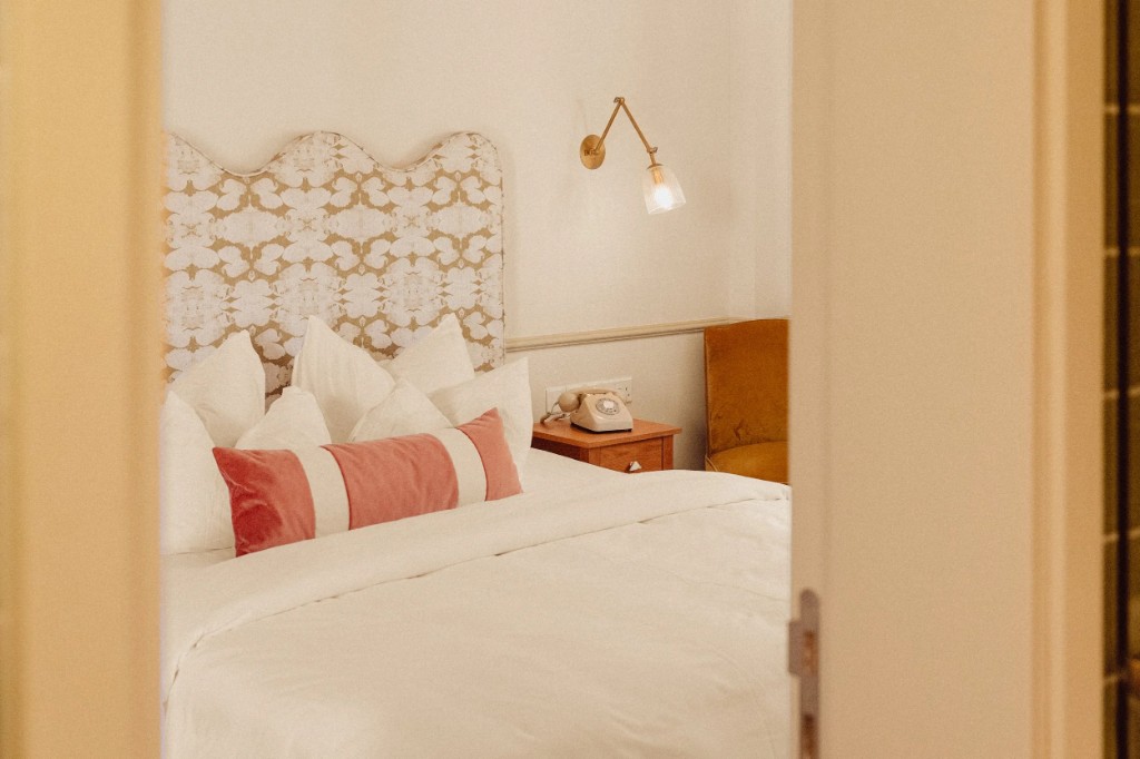 Petite Room · bedside detail with retro telephone
