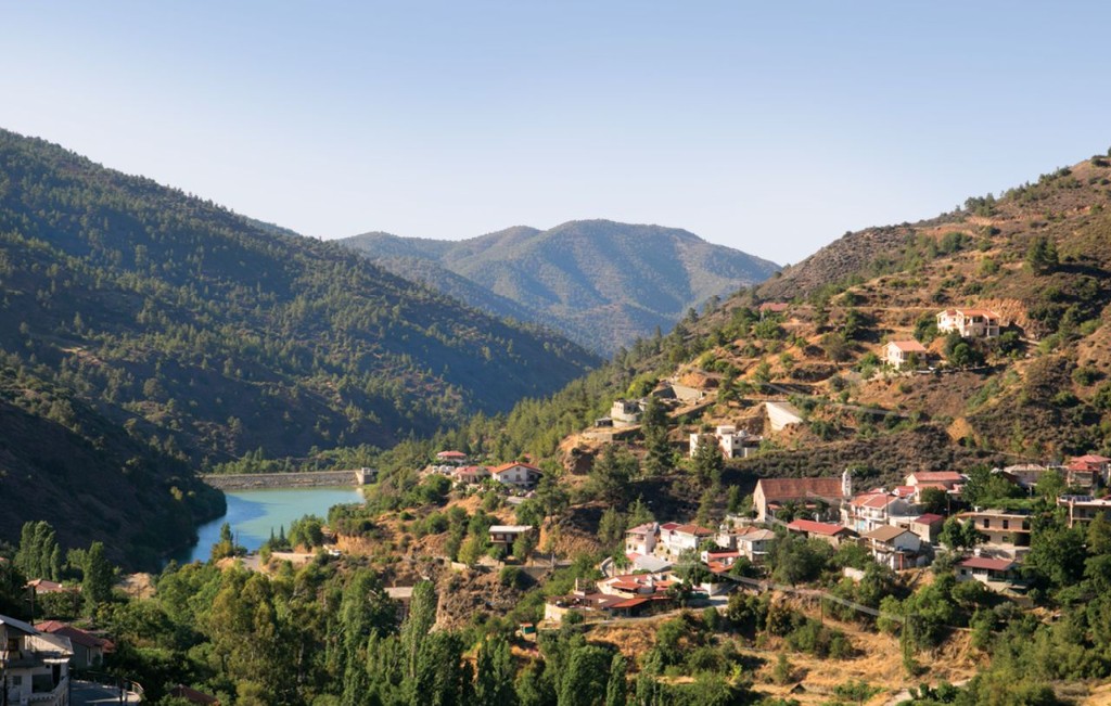 Stone village houses on the green hillsides of the Marathasa Valley, Cyprus