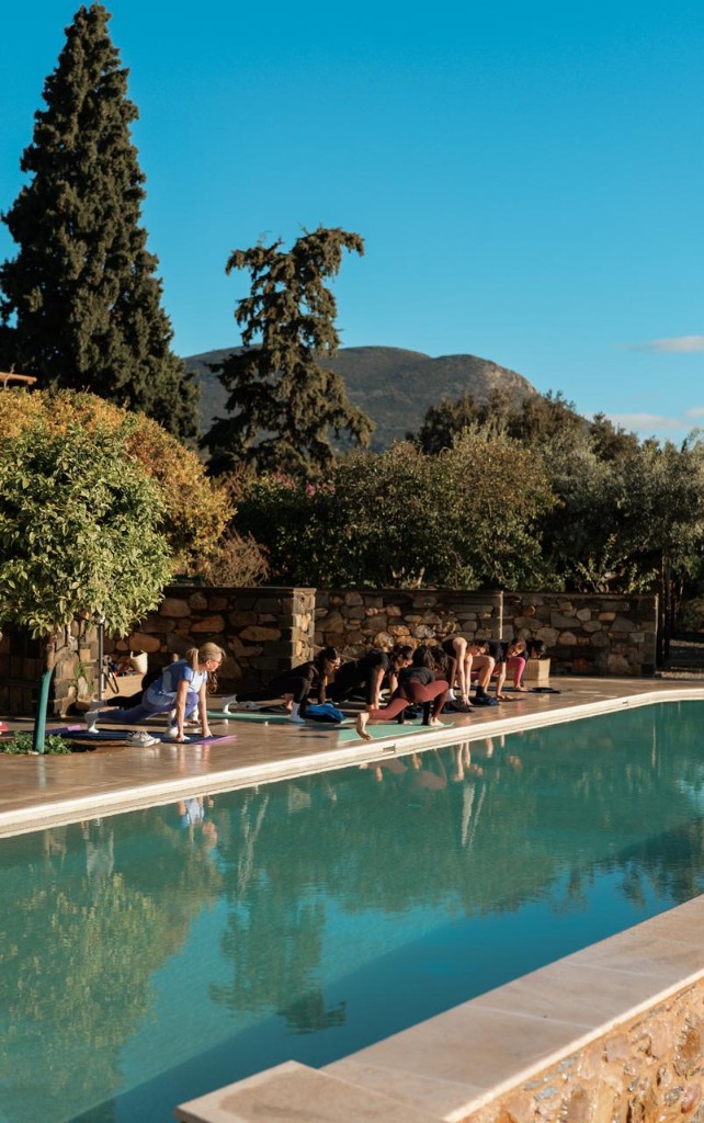 Morning yoga beside the pool